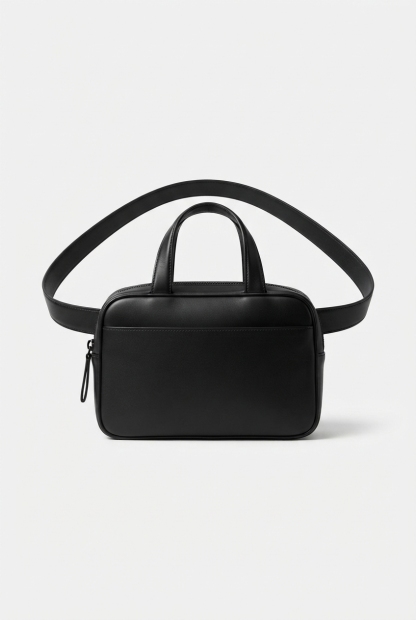 Black belt bag centered on matte off-white surface